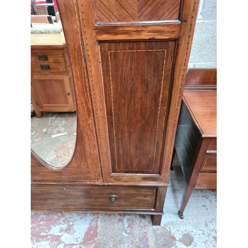 463 - An Edwardian inlaid mahogany four piece bedroom suite comprising dressing table with oval bevel edge... 