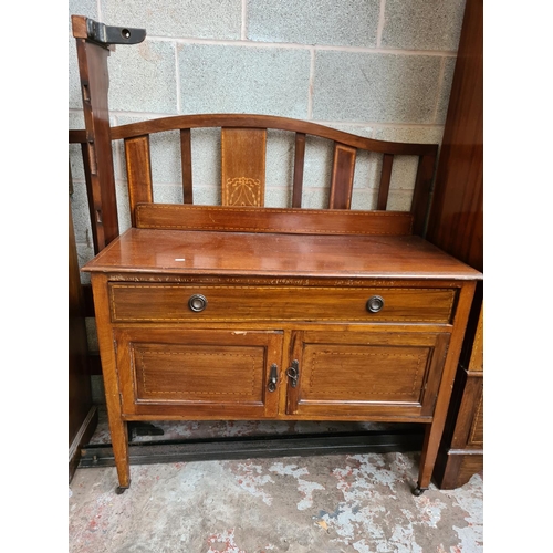 463 - An Edwardian inlaid mahogany four piece bedroom suite comprising dressing table with oval bevel edge... 