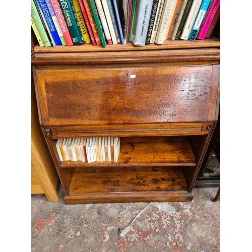 464 - A bespoke pine bureau bookcase with fall front, internal storage, four upper shelves and two lower s... 