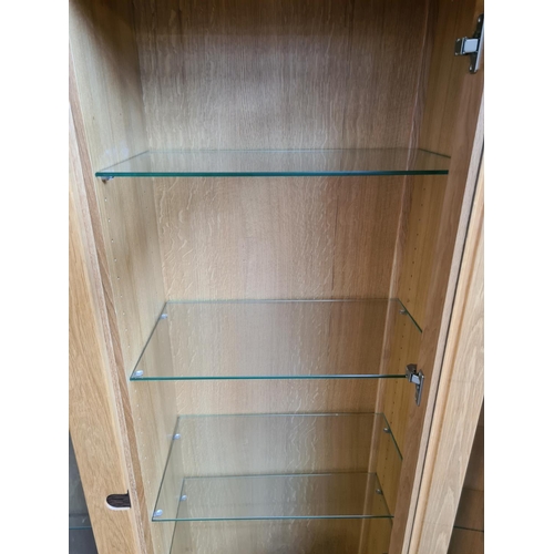 465 - An Exigence oak display cabinet with two glazed doors, rosewood effect escutcheon, key and eight gla... 