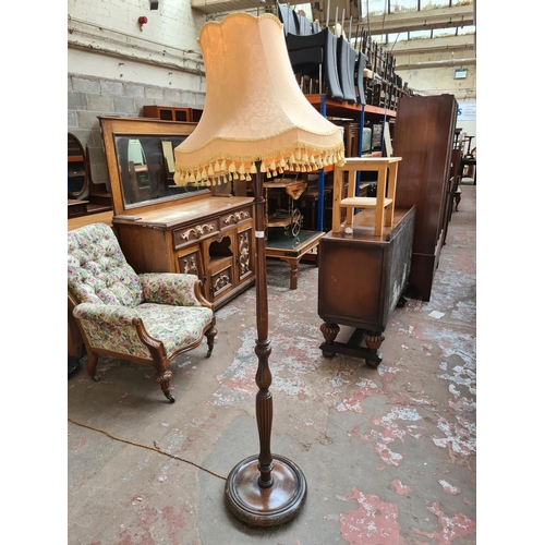 468 - An early 20th century mahogany standard lamp with tassel shade, reeded support and stepped base