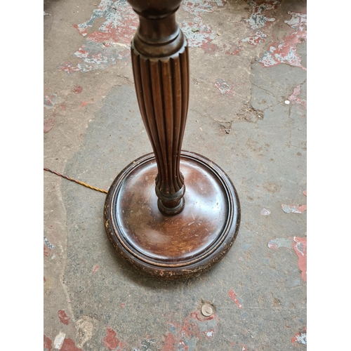 468 - An early 20th century mahogany standard lamp with tassel shade, reeded support and stepped base