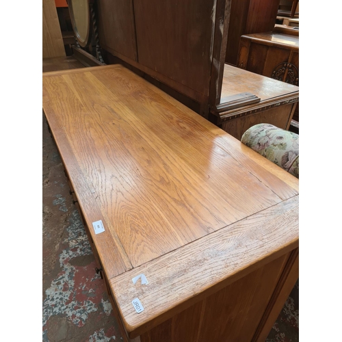 469 - A modern oak sideboard with three drawers and three lower cupboard doors - measuring approx. 160cm x... 