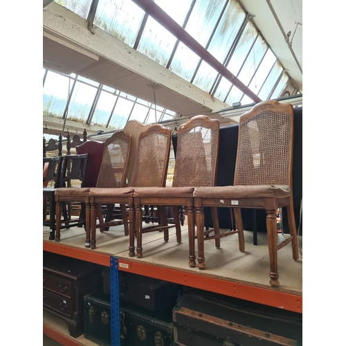 472 - Four French style walnut dining chairs with rattan backs and brown upholstery