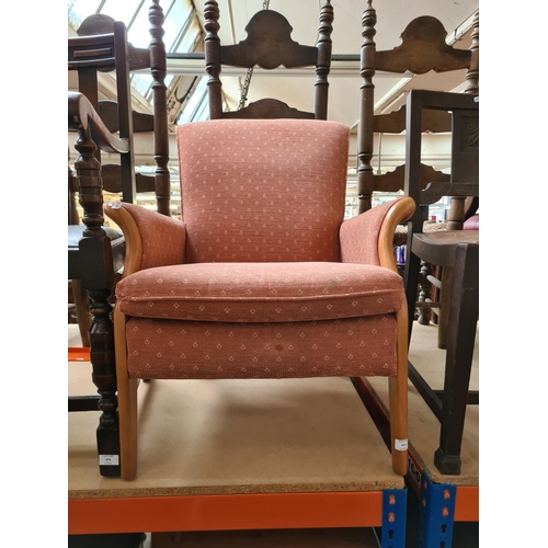 474 - A Parker Knoll beech framed armchair with pink upholstery