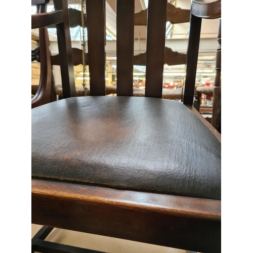 475 - Two vintage oak carver dining chairs with brown leatherette upholstery