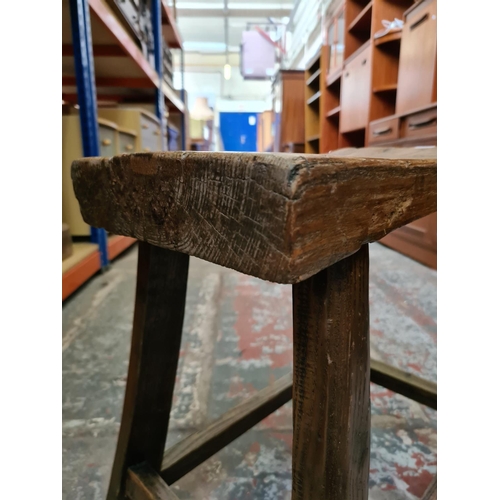 478 - A rustic oak farmhouse stool