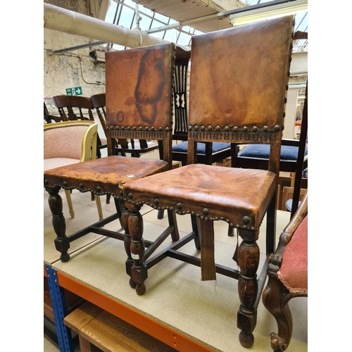 480 - Two early 20th century oak framed dining chairs with brown leather upholstery (see condition report)