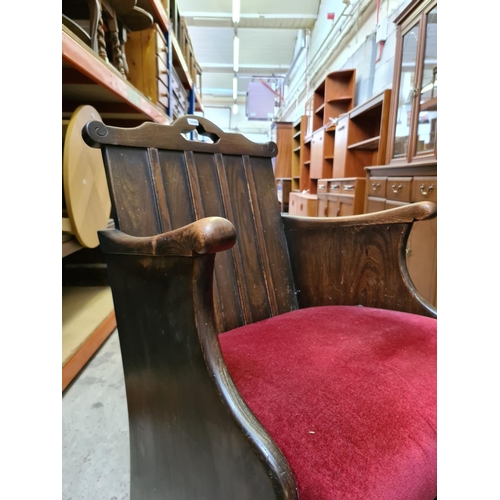 482 - An oak church pew style hall chair with red upholstery