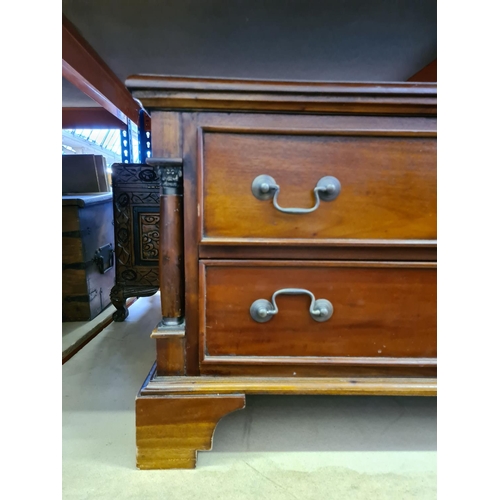 486 - A Georgian style mahogany coffee table with four drawers and brass swan neck handles