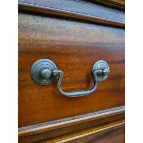 486 - A Georgian style mahogany coffee table with four drawers and brass swan neck handles