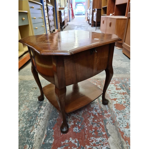 489 - Two items to include an oak circular side table on barley twist supports and a vintage walnut sewing... 