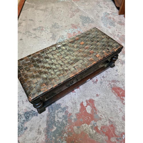 493 - A vintage oak and leather rectangular footstool