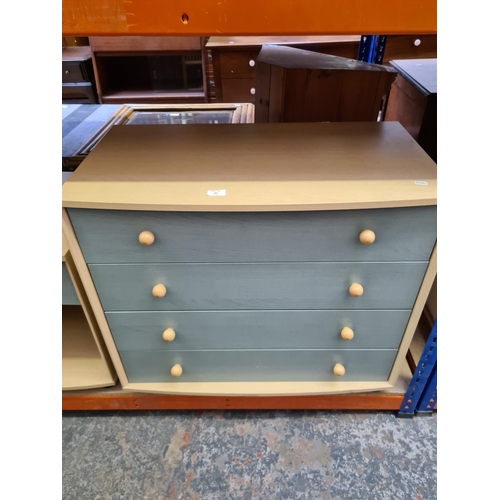 497 - A modern beech effect and sage green chest of four drawers and two matching single drawer bedside ca... 