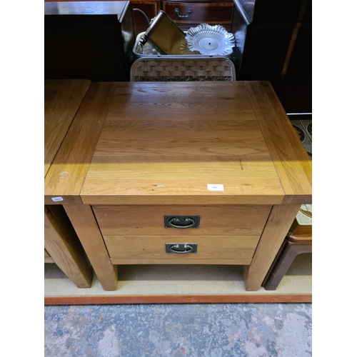 501 - A pair of modern oak square bedside tables with single drawer