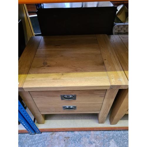 501 - A pair of modern oak square bedside tables with single drawer