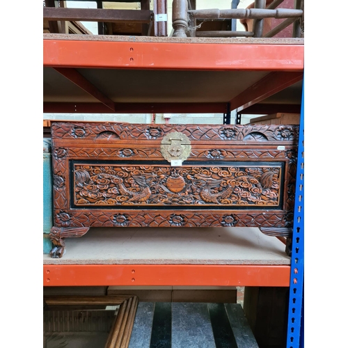 523 - A Chinese camphor wood blanket chest with brass clasp