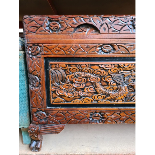 523 - A Chinese camphor wood blanket chest with brass clasp