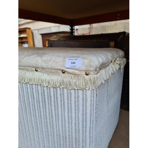 526 - A Lloyd Loom style white painted wicker ottoman with white upholstered top and contents