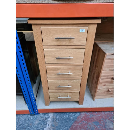 529 - A modern oak chest of five drawers