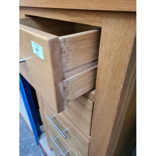 529 - A modern oak chest of five drawers