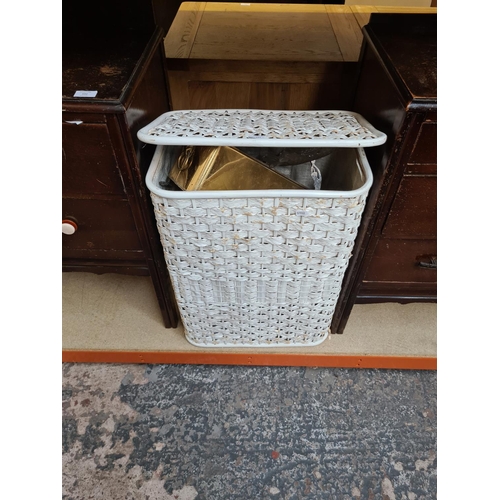 531 - A vintage wicker laundry basket containing various items to include Art Deco style chrome pedestal d... 