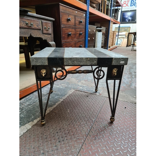 536 - A contemporary marble effect square side table on black and gold painted wrought iron base with lion... 