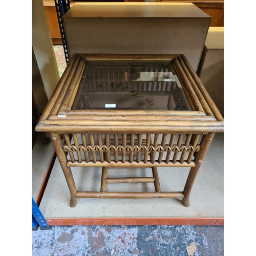 537 - Two items to include a modern cane rectangular side table with glass insert and a vintage Lloyd Loom... 