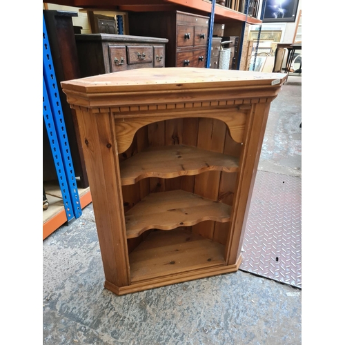 538 - A pine wall mountable corner cabinet