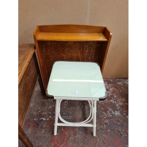 549 - Two items to include a vintage Lloyd Loom style white painted side table with glass top and a vintag... 