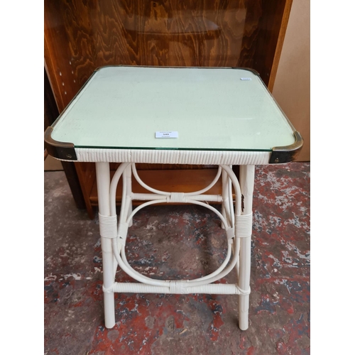 549 - Two items to include a vintage Lloyd Loom style white painted side table with glass top and a vintag... 