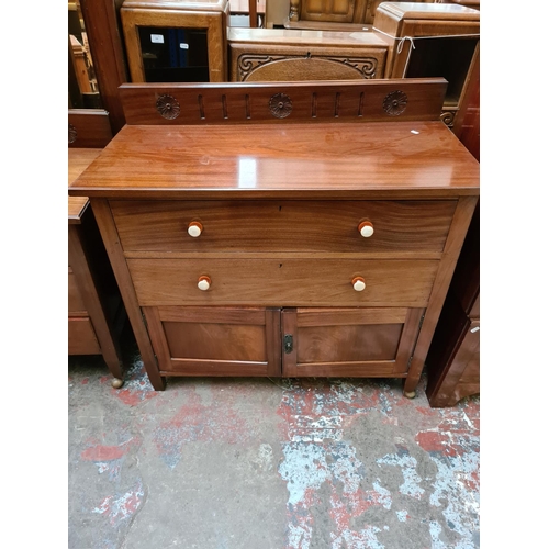 552 - An Edwardian mahogany three piece bedroom suite comprising single door wardrobe with oval bevel edge... 