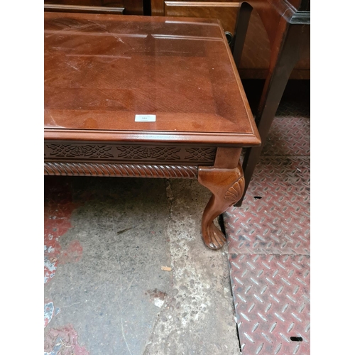 555 - A mahogany rectangular coffee table on cabriole supports