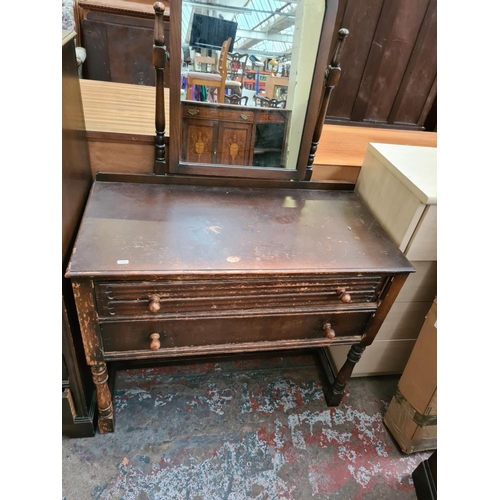 571 - Two items to include a Priory style oak cabinet with two doors and two drawers and a matching dressi... 