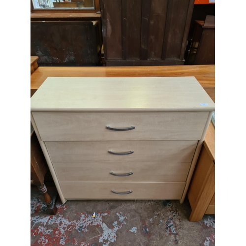 573 - A modern beech effect chest of four drawers