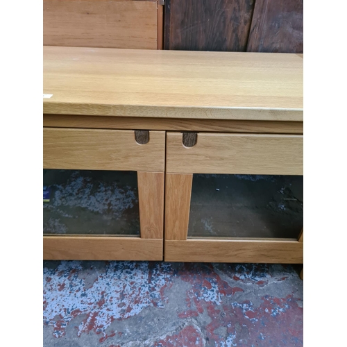 574 - An Exigence oak TV stand with two glazed doors (matches lots 465, 575 and 576)