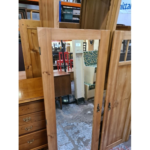 583 - A pine triple door wardrobe