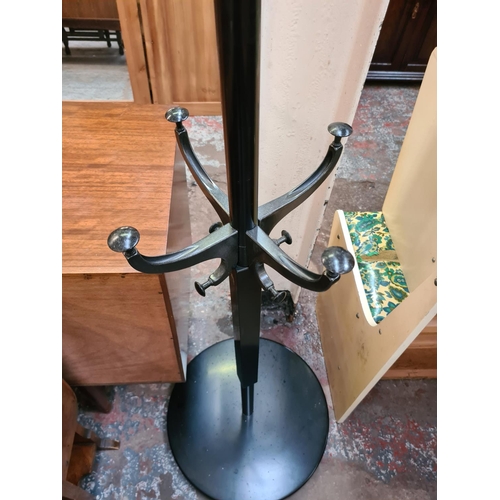 587 - A modern black metal two section coat stand