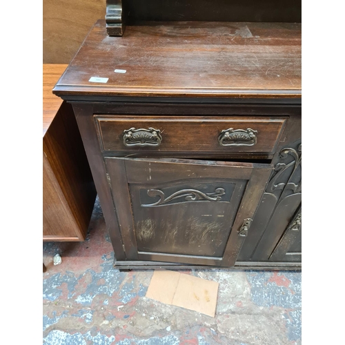 589 - An Edwardian mahogany mirrored back sideboard with corinthian column supports, Art Nouveau type hand... 