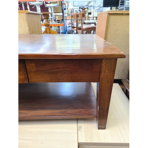 593 - A modern oak effect two tier rectangular coffee table with single drawer