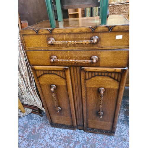 616 - Three items to include an Art Deco style oak tall boy, green painted side table and a vintage oak ba... 