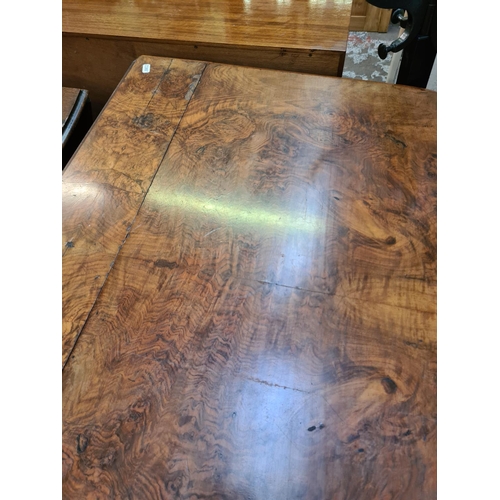 618 - A vintage walnut drop leaf dining table