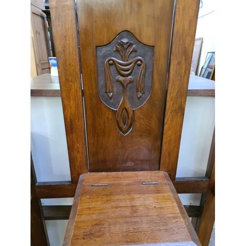 620 - Two items to include an Edwardian mahogany hall stand with bevel edged mirror, four coat hooks, glov... 