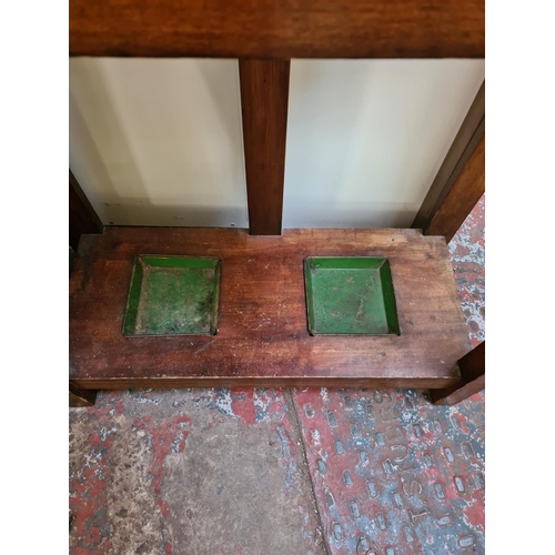 620 - Two items to include an Edwardian mahogany hall stand with bevel edged mirror, four coat hooks, glov... 