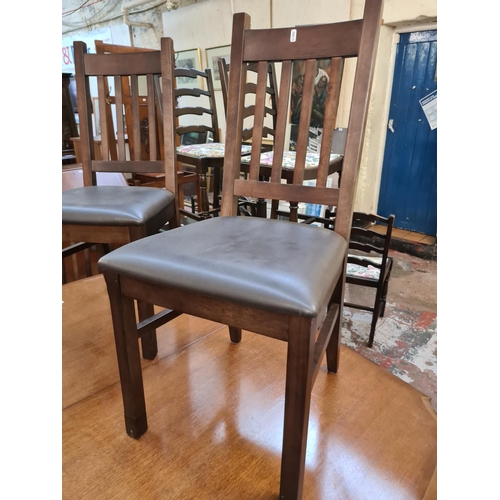 622 - Four modern oak effect dining chairs with brown leatherette upholstery