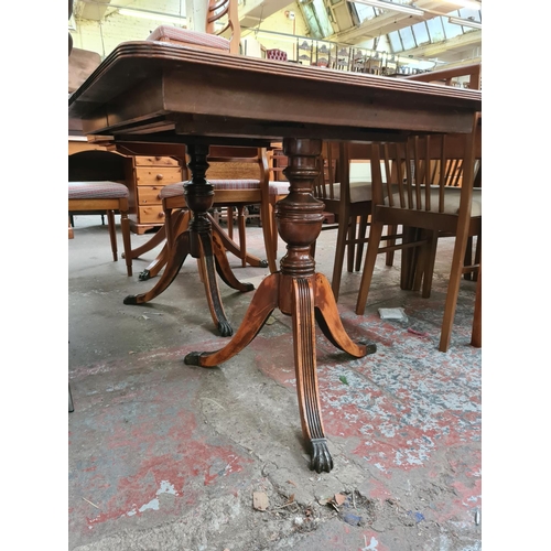 636 - An antique style mahogany extending twin pedestal dining table (see condition report)