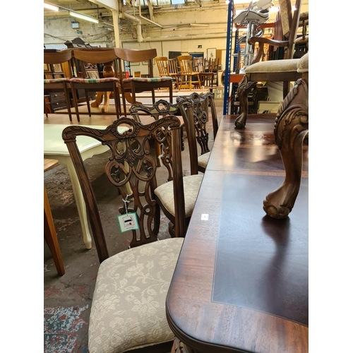 638 - An impressive Chippendale style mahogany extending refectory dining table with six matching dining c... 