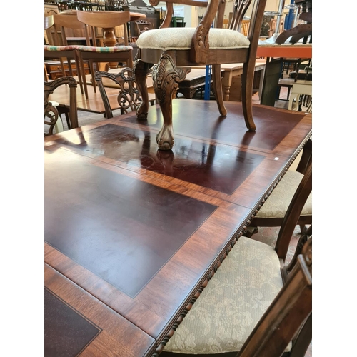 638 - An impressive Chippendale style mahogany extending refectory dining table with six matching dining c... 