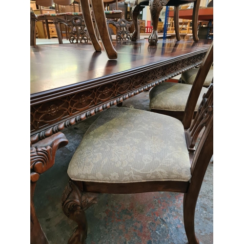 638 - An impressive Chippendale style mahogany extending refectory dining table with six matching dining c... 