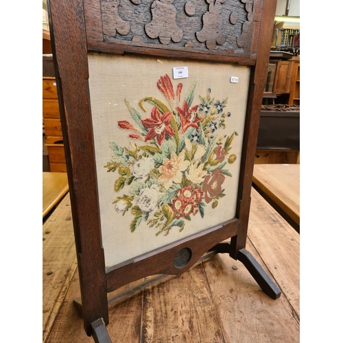 646 - A vintage oak framed tapestry fire screen